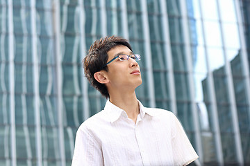 Image showing asian young, handsome business man at the office building . 