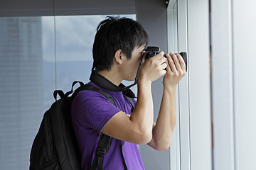 Image showing photographer takes a photo of the landscape indoor