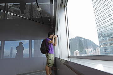 Image showing photographer takes a photo of the landscape indoor