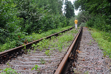 Image showing Walking Away Down Abandoned Railroad Track