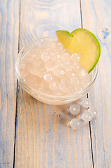 Image showing tapioca pearls with lime. white bubble tea ingredients