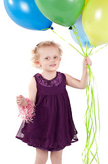 Image showing Little cute girl with multicolored air balloons