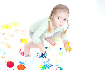 Image showing Little girl playing with colors