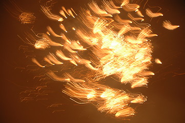 Image showing Yellow firework flies