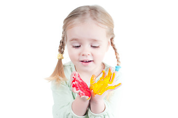 Image showing Little girl playing with colors