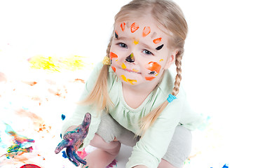 Image showing Little girl playing with colors