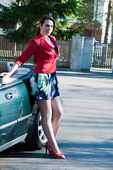 Image showing Beautiful brunette woman in car