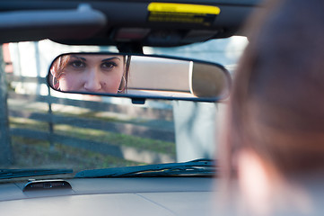 Image showing Beautiful brunette woman in car