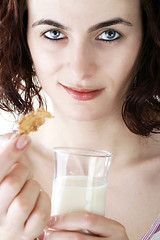 Image showing Young people eating milk with cereals