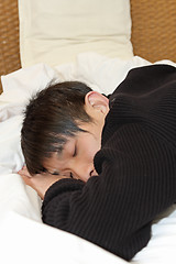 Image showing Man comfortably sleeping in his bed 