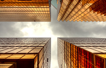 Image showing Skyscrapers with clouds reflection 