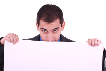 Image showing Young man, looking down to a blank board. 