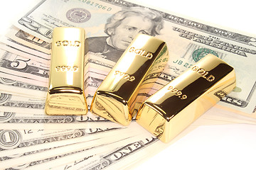 Image showing three gold bars on dollar bills