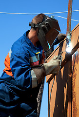 Image showing A welder working at height