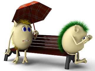 Image showing Two unhappy puppets sitting on brown bench