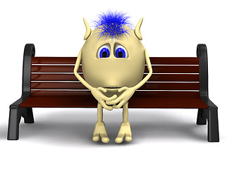 Image showing Haired puppet thinking on brown park bench