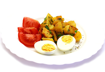 Image showing Eggs laying next to potatoes and tomatoes