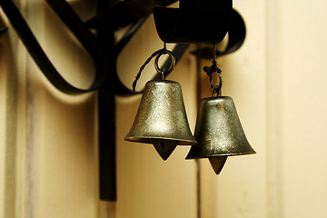 Image showing Zoomed foto of hanging metallic colored bells