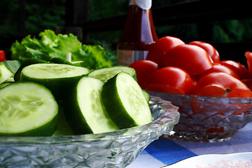Image showing Foto of cucumber and tomatoes in dishes