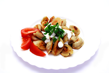 Image showing Foto of dumplings and tomato on plate