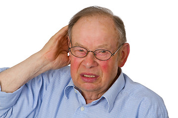 Image showing Male senior with hand on ear