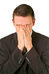 Image showing Businessman hiding his face in shame