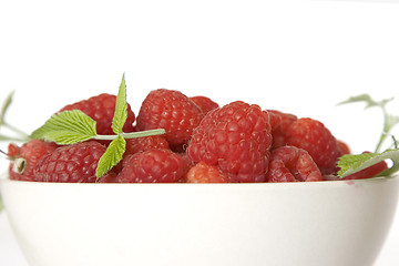 Image showing Ripe raspberry with green leaf