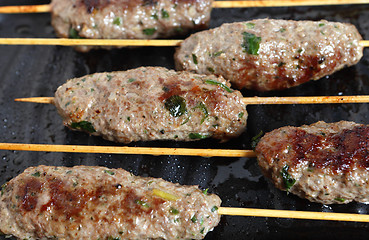 Image showing Lamb Kofta on a grill plate