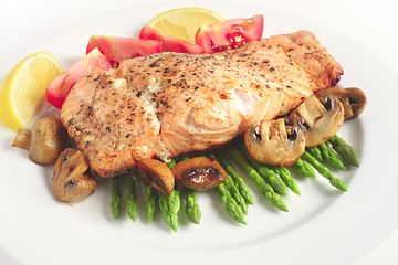 Image showing Pan-seared salmon steak and veg