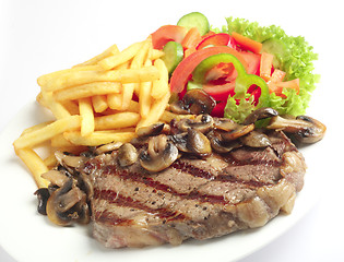 Image showing Steak chips and mushrooms