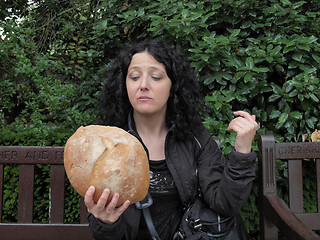 Image showing Girl eating bread