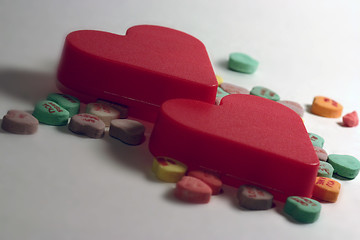 Image showing Two hearts with candy