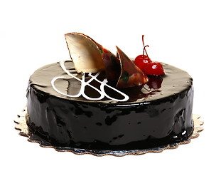 Image showing Chocolate cake decorated with cherries.