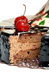 Image showing Chocolate cake decorated with cherries.