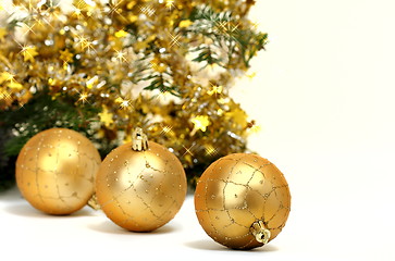 Image showing Gold Christmas balls on white background.