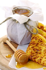Image showing Pancakes with honey.