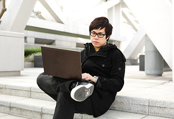 Image showing man using computer outdoor