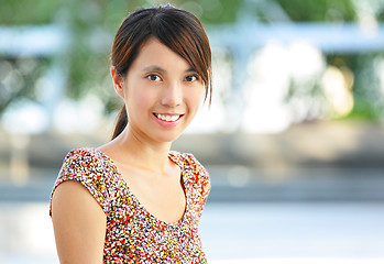 Image showing young woman smiling friendly