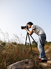 Image showing Photographer taking photo at wild