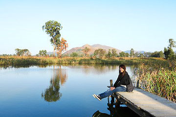 Image showing girl on pier at lake