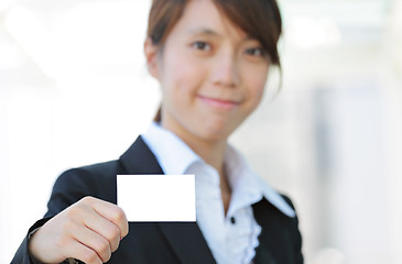 Image showing business woman showing blank card