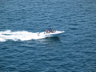 Image showing Small boat with people