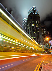 Image showing light trails on the modern building background