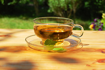 Image showing cup of tea in the garden