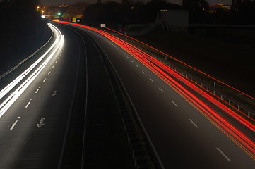 Image showing road with car traffic at night with blurry lights