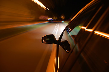 Image showing night drive with car in motion 