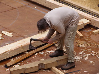 Image showing Handworker with old axe