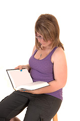 Image showing Young girl reading book.