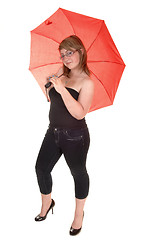 Image showing Umbrella holding teenager.