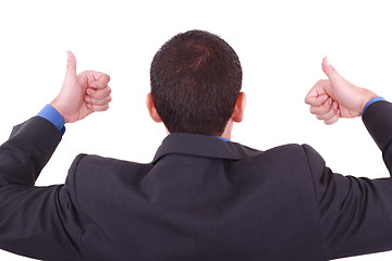 Image showing A businessman gives a thumbs up (back)